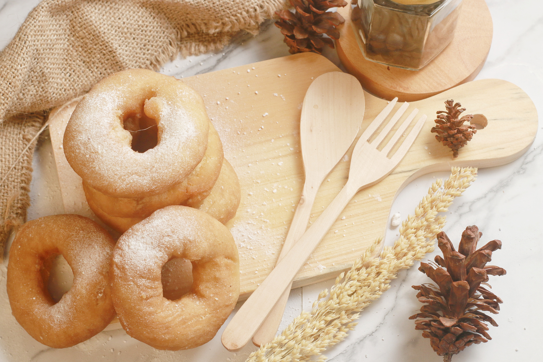 Close-Up Shot of Doughnuts on a Wooden Chopping Board